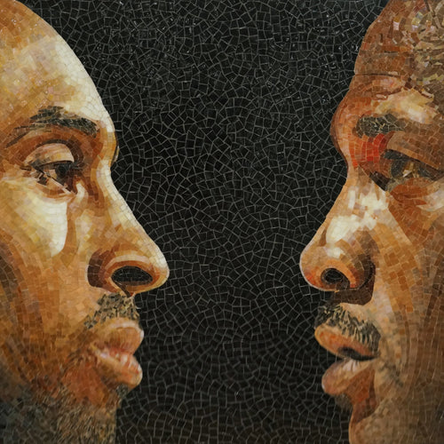 Mosaic artwork of two faces on a black background