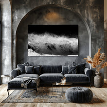 Modern living room with a gray sectional sofa, abstract artwork, and decorative elements.