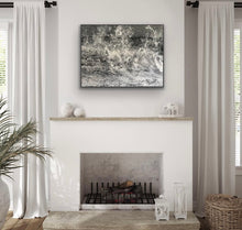 Living room with a fireplace, abstract painting, and decorative items.