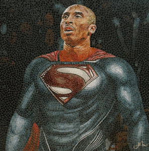 Mosaic artwork of a superhero in a studio setting