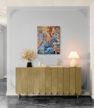 Gold sideboard against a gray wall with decorative elements