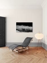 Modern interior with a chaise lounge, floor lamp, and abstract art on the wall.
