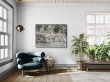 Modern living room with a blue armchair, abstract painting, and potted plants.