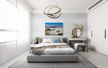 Modern bedroom with a bed, desk, and decorative elements.