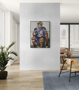 Framed artwork of a person in a colorful outfit on a wall in a modern room.