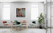 Modern dining area with colorful chairs and a painting on the wall.